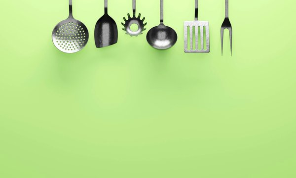 What are the implications of using different materials for kitchen utensils?
